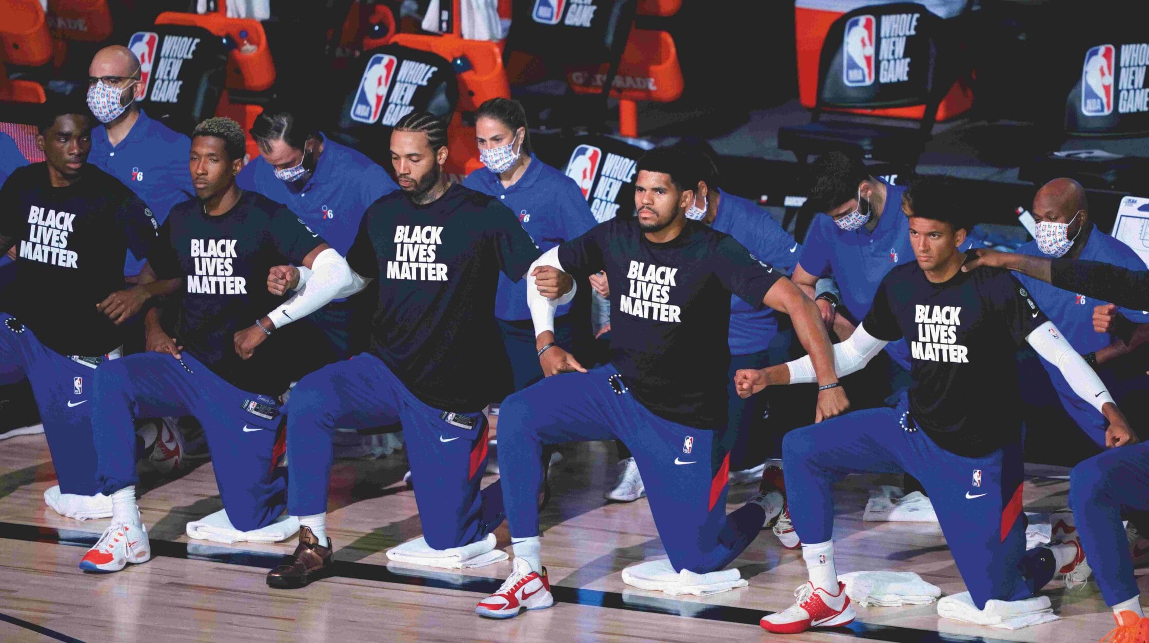 NBA Players join the Black Lives Matter protest by kneeling on the court