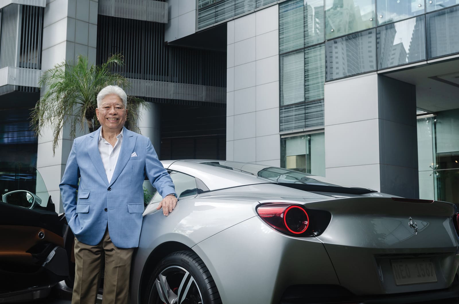 Charlie Rufino poses next to his Ferrari Portofino.