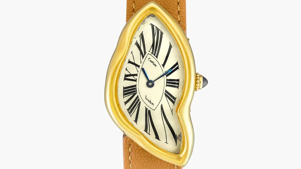 Gold-toned Cartier wristwatch with a melted, teardrop-shaped dial and brown leather strap