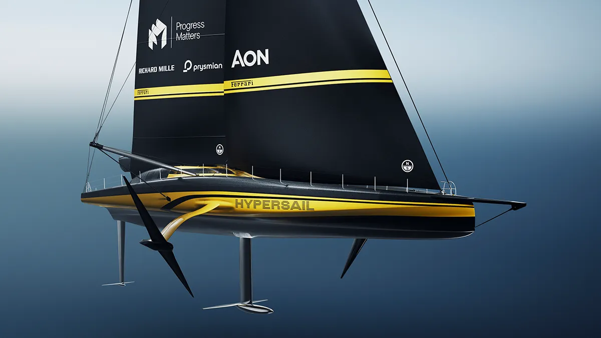 Foiling sailboat with black sail and yellow hull branding, named HyperSail, gliding above blue water with sponsor logos.