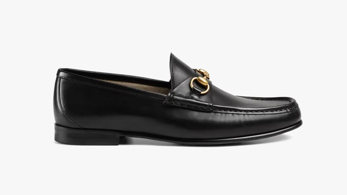 Black leather loafer with gold horsebit detail on the vamp (men's dress shoe)
