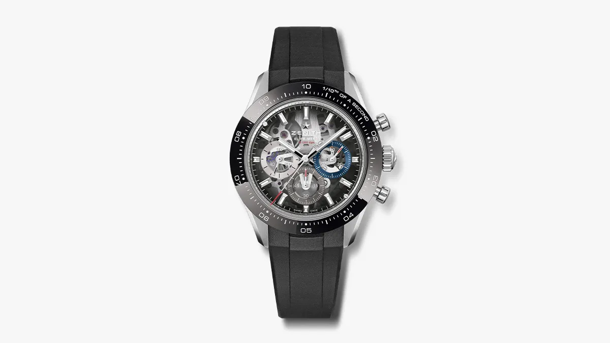 Skeleton-dial chronograph wristwatch with a black rubber strap and blue subdial accents.