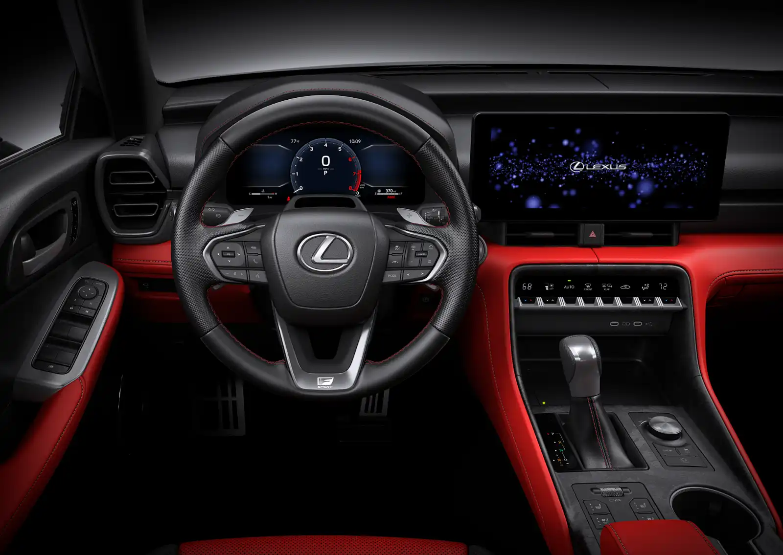 Lexus car interior with a leather-wrapped steering wheel, red contrast stitching, digital instrument cluster, and center console screen.