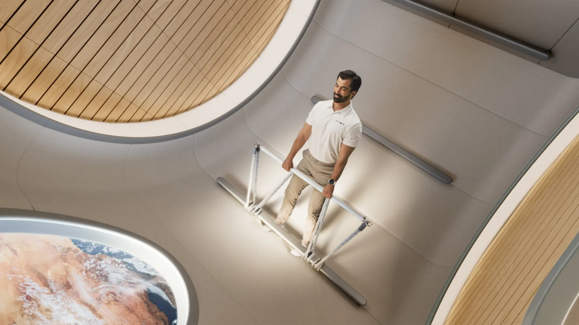 Man standing on a metal railing stairway in a modern interior, with a large globe image visible in the foreground.