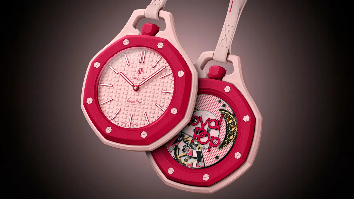 Pink and red Swatch pocket watch with a white textured dial and red hands