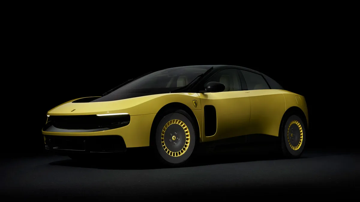 Yellow luxury sports car with black roof, photographed in a dark studio background, side view near the front quarter panel. 0h5a9e1a-1a2f-4c4b-9c9e-8f2b4b6f1d7d is not included but placeholder for context.