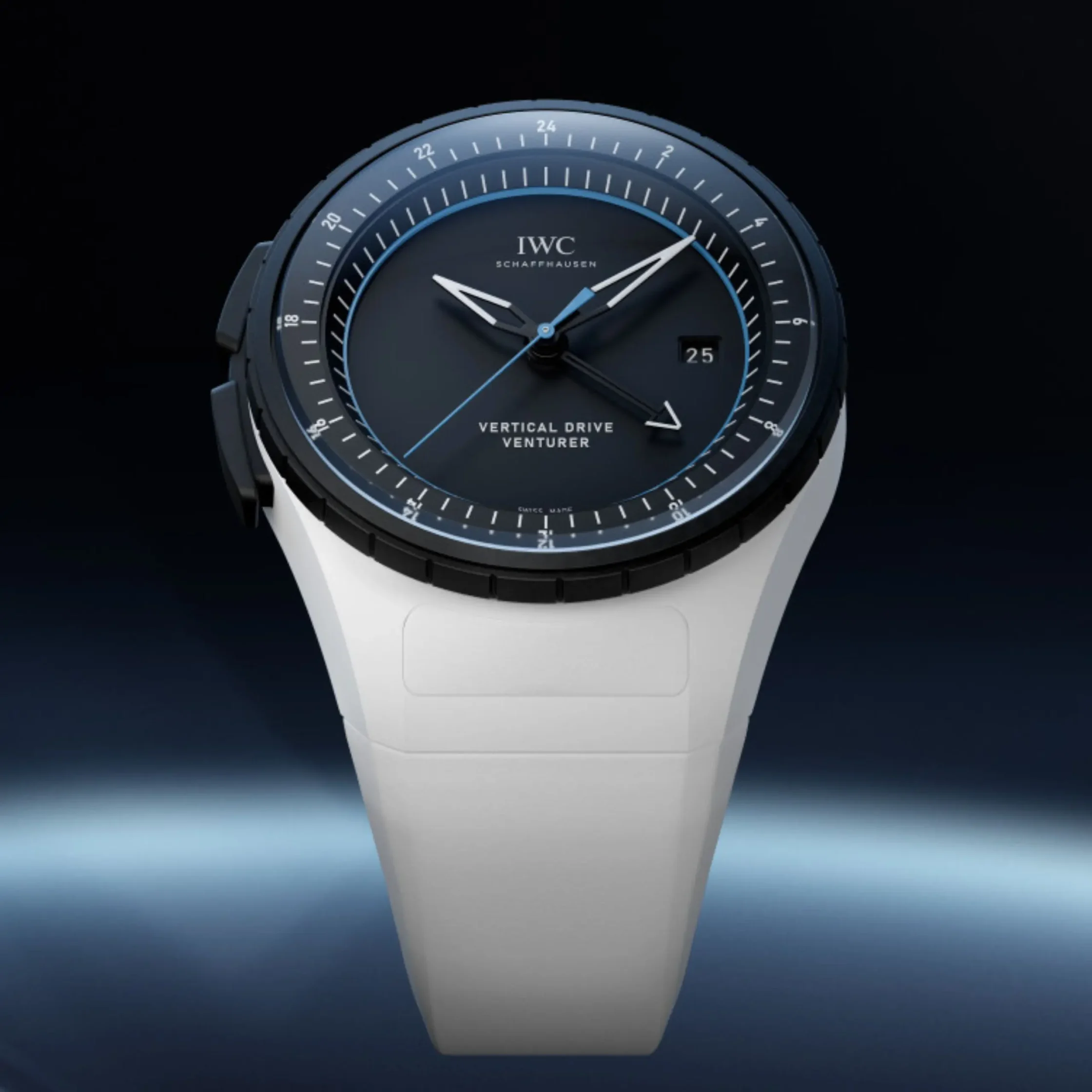 Close-up of an IWC Schaffhausen wristwatch with a blue-accented dial, rotating bezel, and white strap against a dark gradient background.