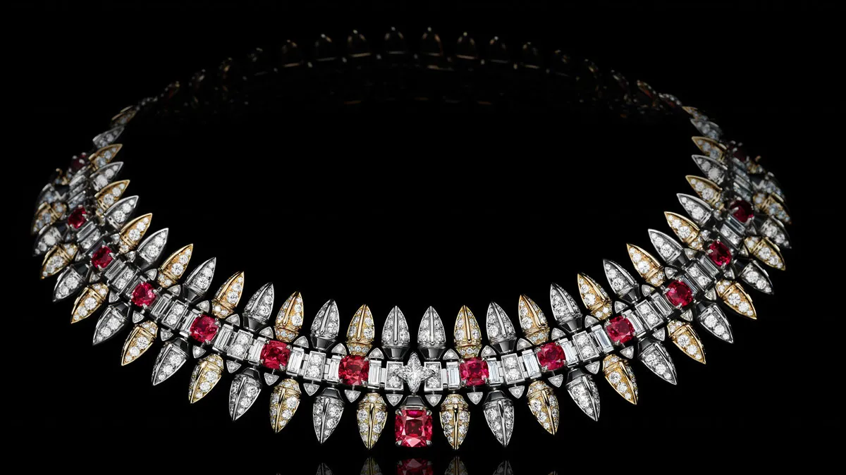 Diamond necklace with red rubies and white diamonds on a black background, elegant and sparkling centerpiece jewelry. (Informative)