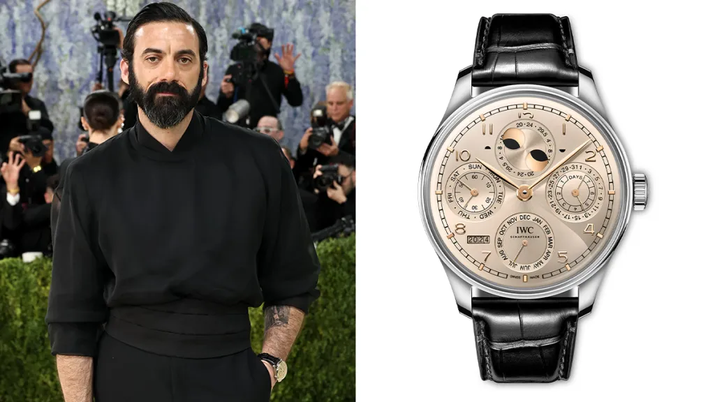 Bearded man in black at a formal event with photographers in the background, shown beside a luxury wristwatch.