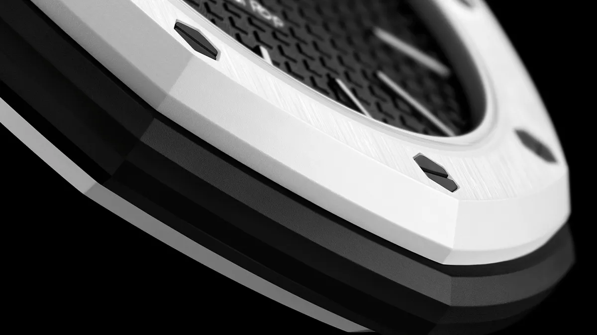 Close-up of a white curved device edge with a vented grille and textured surface, against a black background.