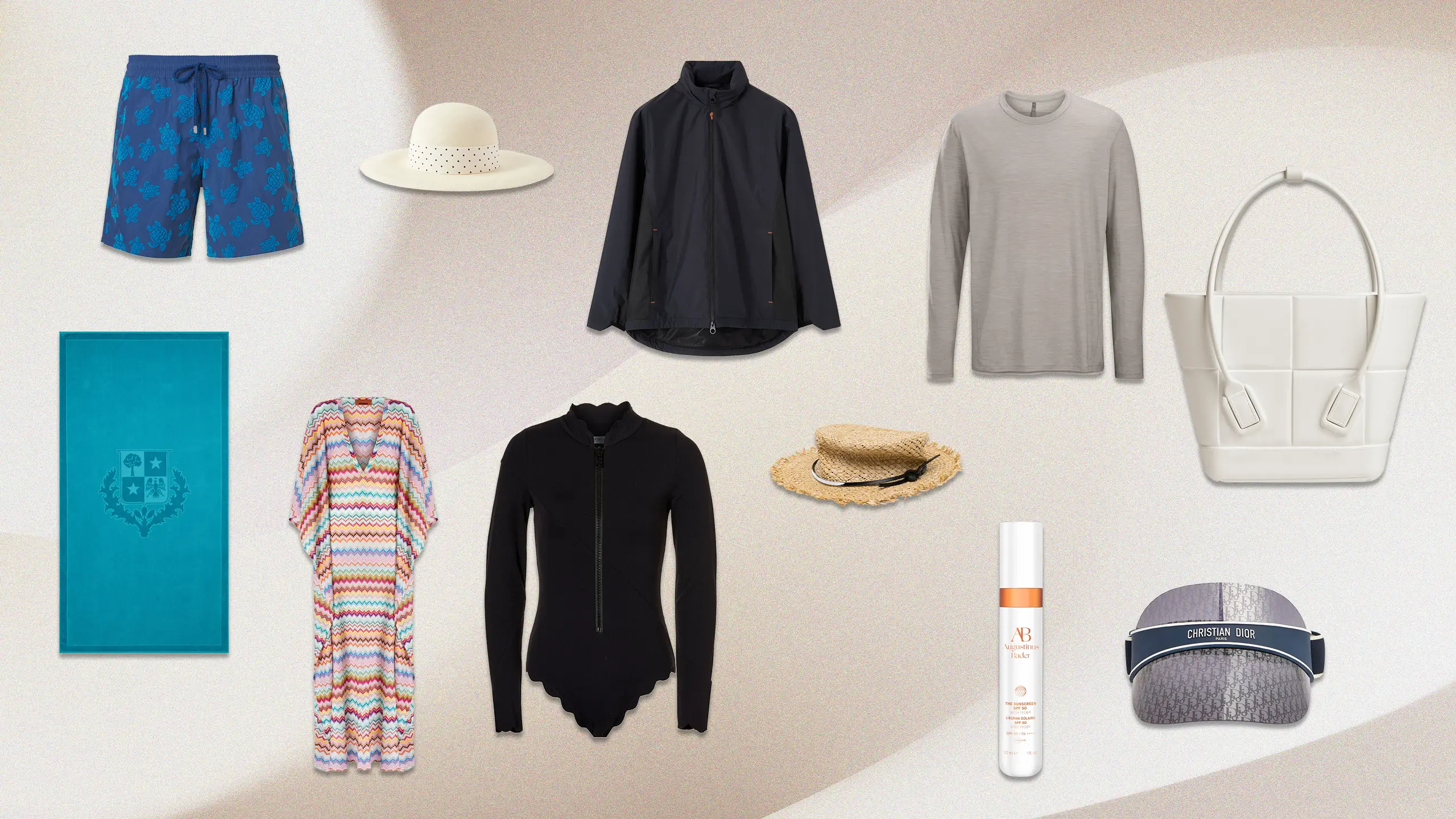 Assorted fashion items arranged on a beige backdrop: blue floral swim shorts, white sun hat, navy lightweight jacket, gray long-sleeve shirt, white tote bag, turquoise notebook, multicolored chevron cardigan, black zip-front cardigan, straw hat, sunscreen spray, and a patterned bucket bag.