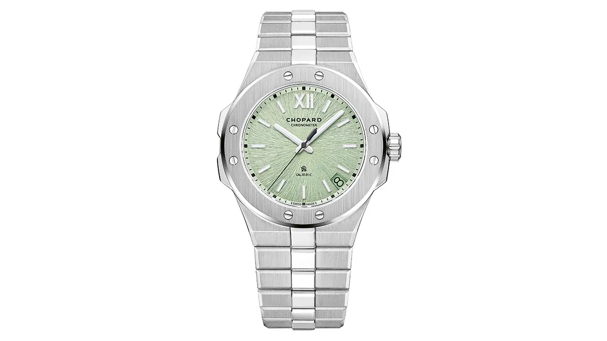 Stainless steel wristwatch with a green textured dial, date window at 3 o'clock, and brushed bezel style accessory.