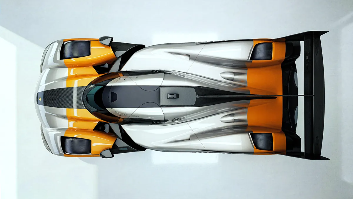 Top-down view of a futuristic orange, white, and gray race car with a large rear wing and sleek cockpit.