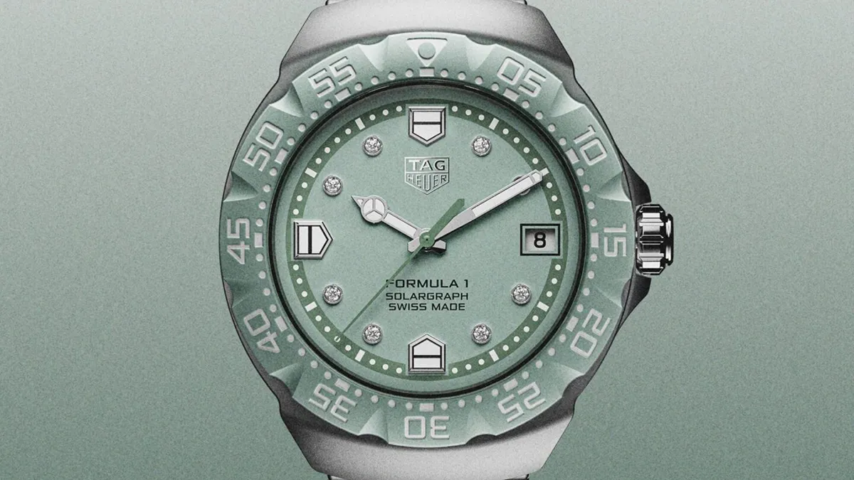 Tag Heuer Formula 1 Solargraph watch with a mint green dial, diamond hour markers, and a date window at 3 o'clock.