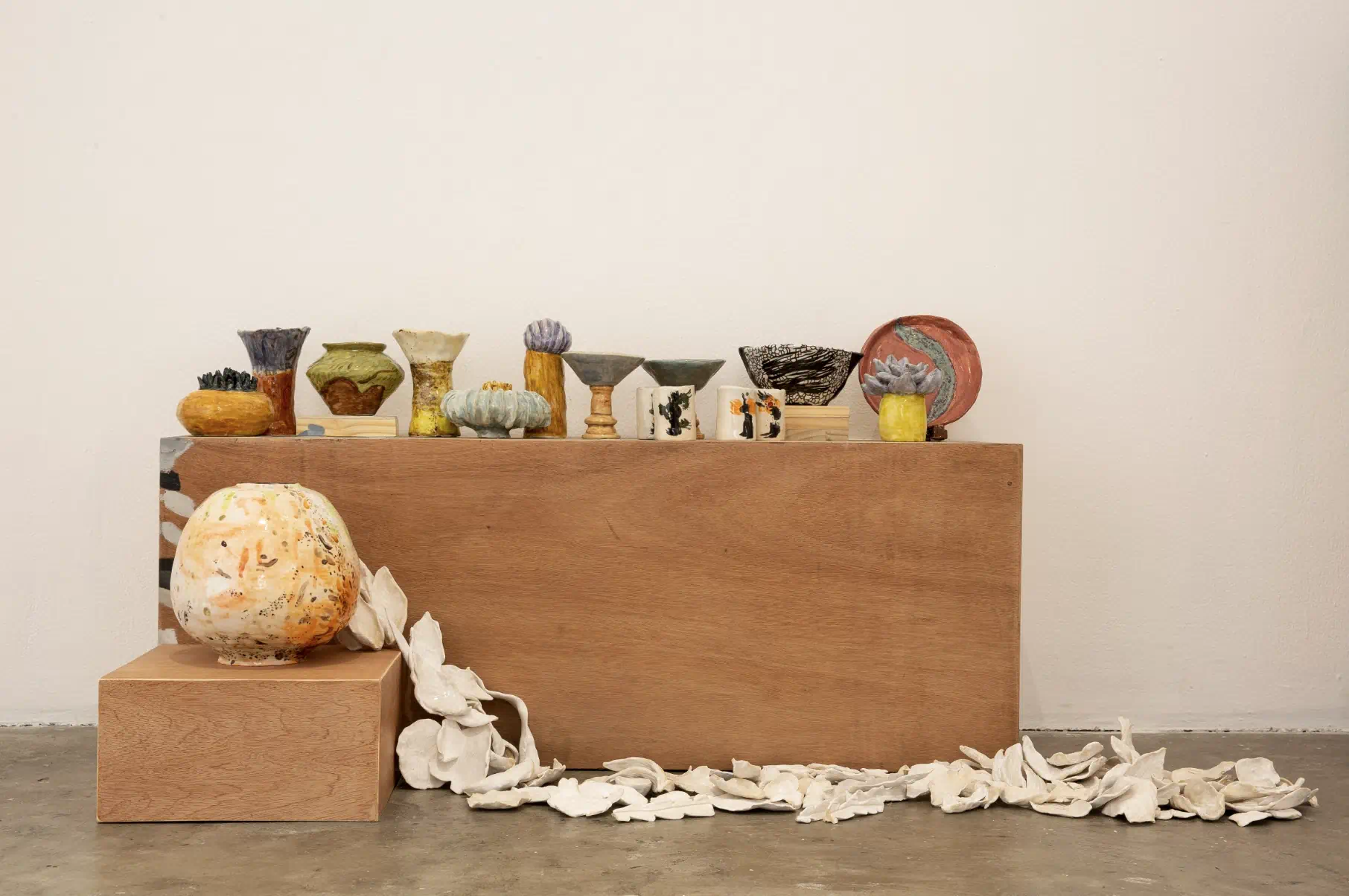 A Record of 16 (with Mia Pettyjohn), 2026, by Hanna Pettyjohn. Oil on plywood, ceramics dimensions variable. Courtesy of Mo_Space
