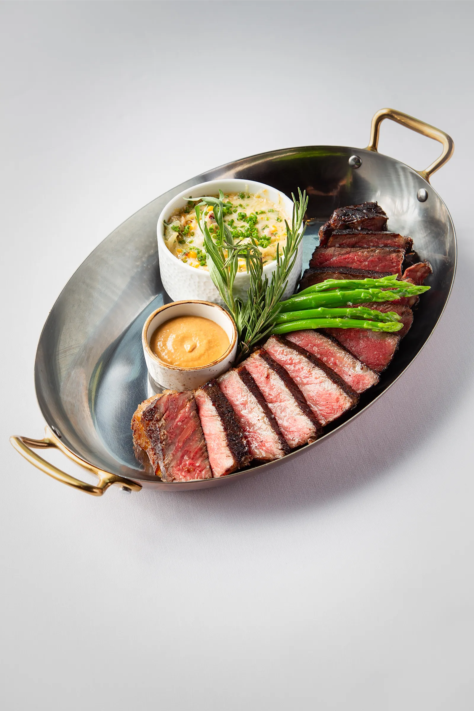 Bone-In NY Strip Red Phoenix MB5 with Cauliflower and Garlic Tahini Corn and Brie Gratin_1
