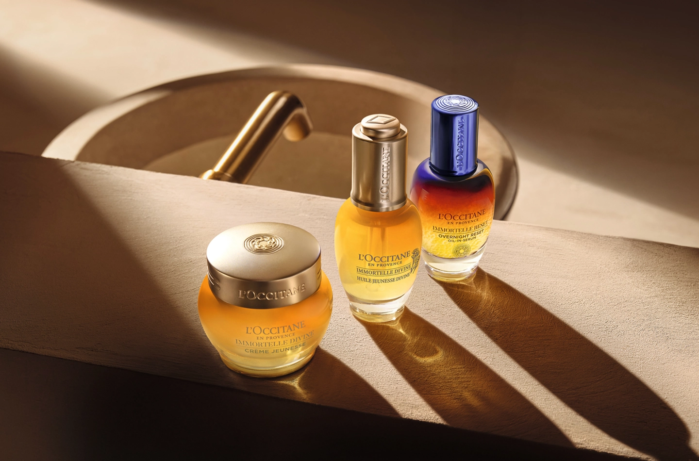 The Immortelle Divine Cream, the Immortelle Divine Youth Oil, and the Immortelle Overnight Reset Eye Serum. L'Occitane